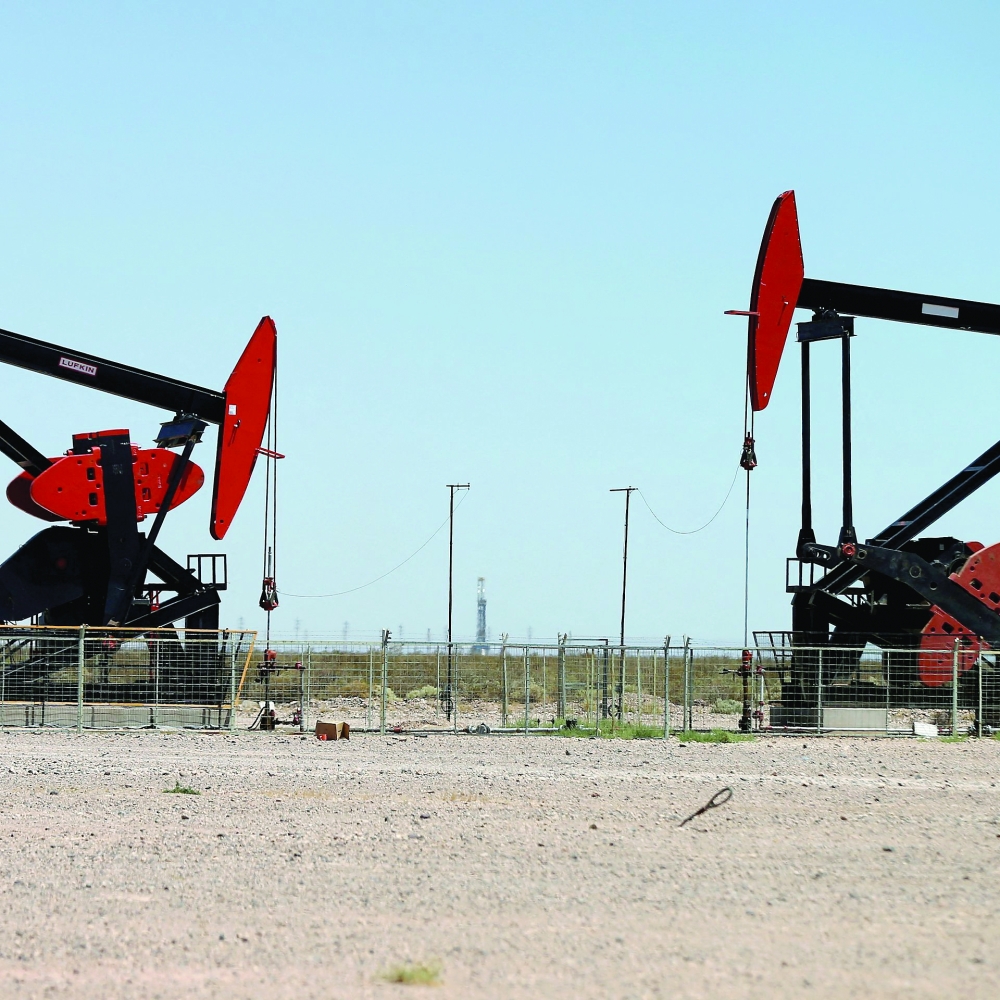 Oil holds near on stronger demand prospects