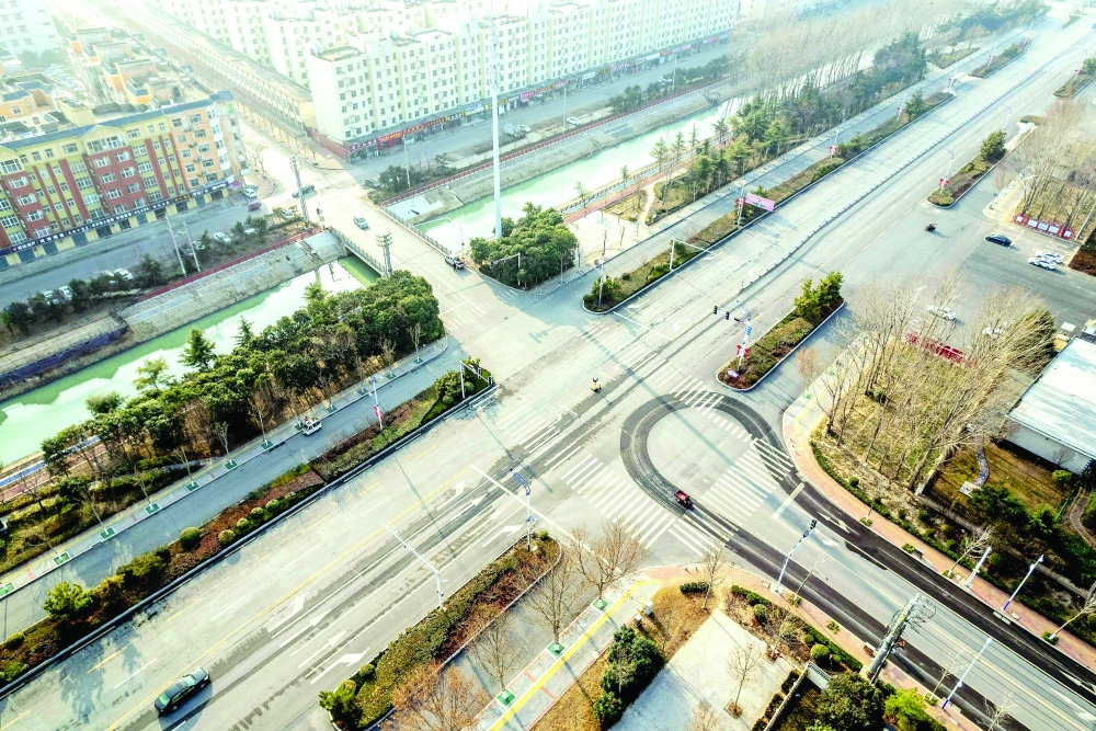 This aerial photo taken on Thursday shows nearly empty roads in an area closed off and restricted due to an outbreak of Covid-19 in Huaxian county in the city of Anyang, in China's central Henan province. - AFP