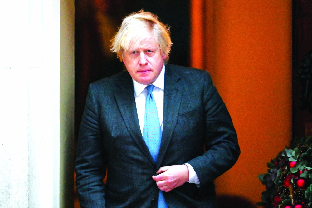 British Prime Minister Boris Johnson leaves Downing Street 10 to meet with Oman's Sultan Haitham bin Tariq, in London, Britain December 16, 2021. REUTERS/Dylan Martinez/File Photo