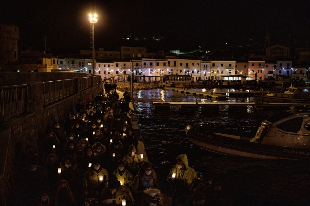 A candlelight procession marked the 10th anniversary of the deadly Costa Concordia shipwreck in Giglio, Italy on Thursday evening, Jan. 13, 2022.