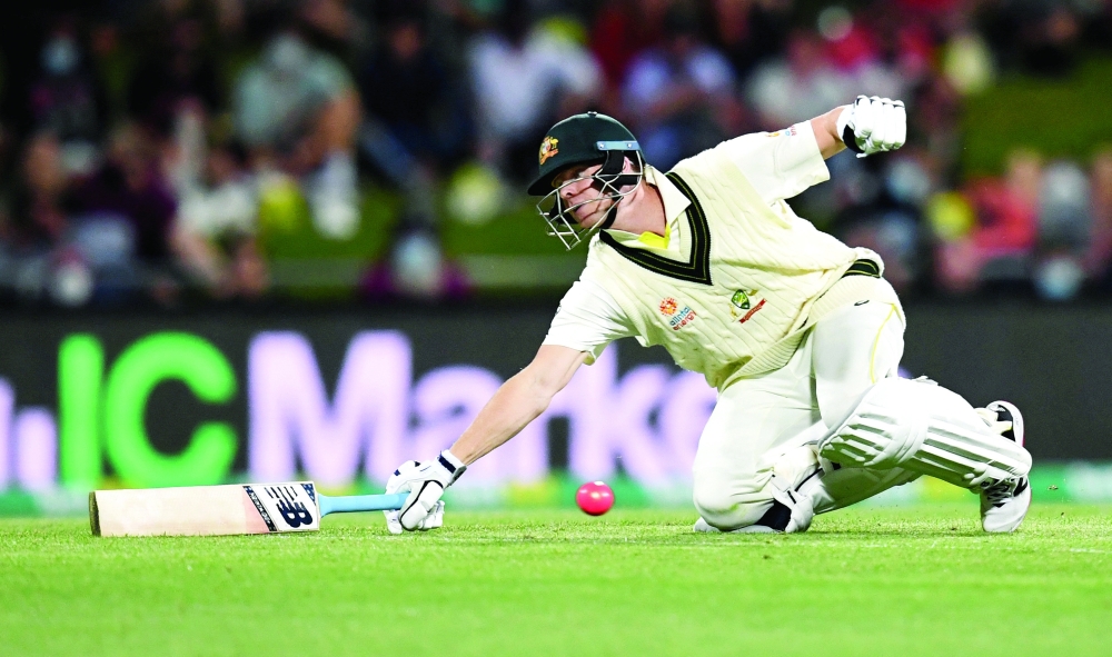 Steve Smith of Australia dives for his crease. -- Reuters