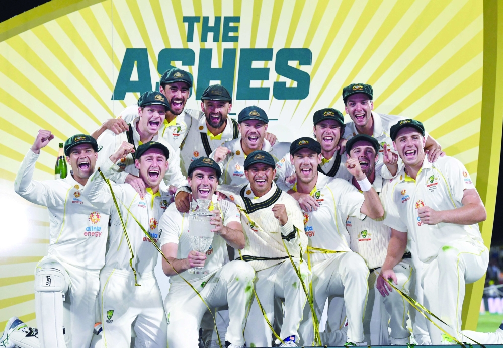 Cricket - Ashes - Fifth Test - Australia v England - Bellerive Oval, Hobart, Australia - January 16, 2022 Australia celebrate winning the Ashes series with the trophy Darren England/AAP Image via REUTERS