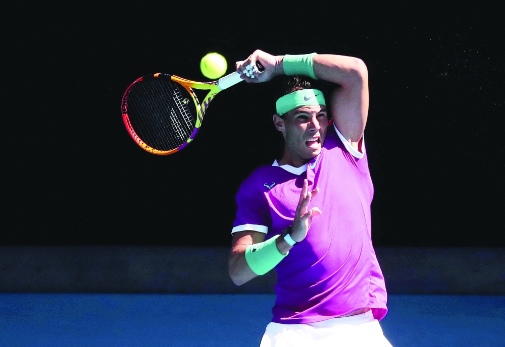 Tennis - Australian Open - Melbourne Park, Melbourne, Australia - January 17, 2022 Spain's Rafael Nadal in action during his first round match against Marcos Giron of the U.S. REUTERS/Asanka Brendon Ratnayake
