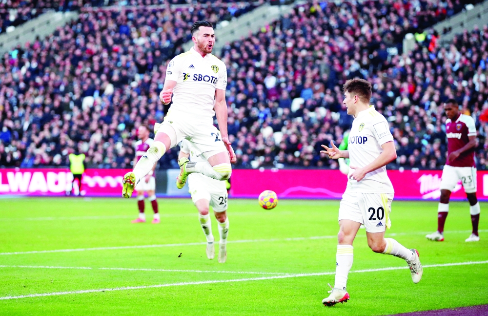 Leeds United's Jack Harrison celebrates scoring their third goal and his hat-trick with Daniel James. -- Reuters
