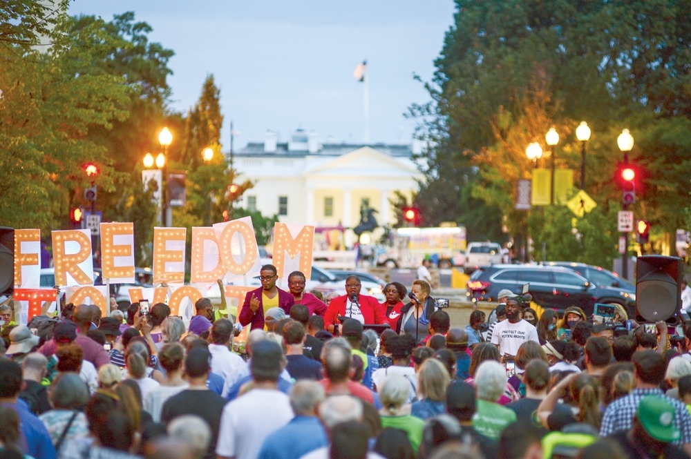 A voting rights demonstration at Black Lives Matter Plaza on the first anniversary of the death of civil rights activist and former Rep John Lewis in Washington.