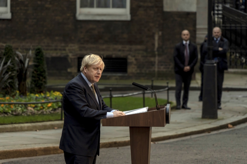 Prime Minister Boris Johnson delivers an address from outside his residence at No. 10 Downing St., in London on Dec. 13, 2019. (Andrew Testa/The New York Times) 
