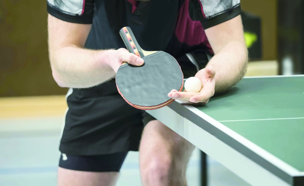 Table,Tennis,Player,Serving,-,Focus,At,The,Blade,And