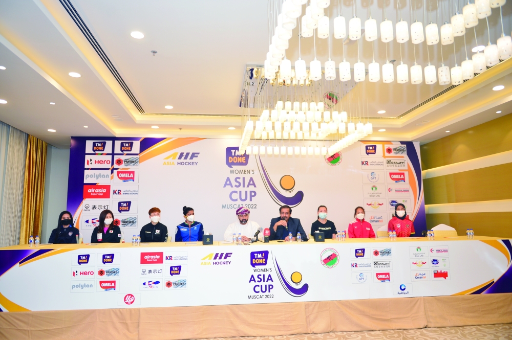 AHF CEO Tayyab Ikram and OHA Chairman Dr Marwan bin Juma al Juma with the team captains after unveiling the Women’s Asia Cup hockey trophy in Muscat on Wednesday. — AbdulWahid al Hamdani