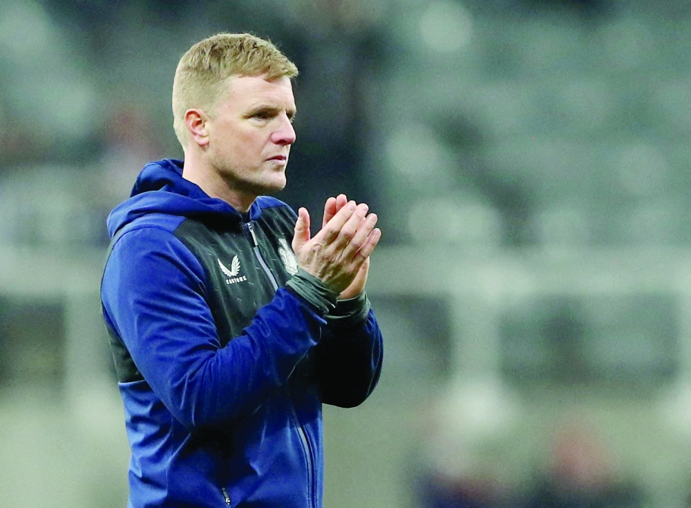 Newcastle United manager Eddie Howe applauds fans after the match. --  Reuters