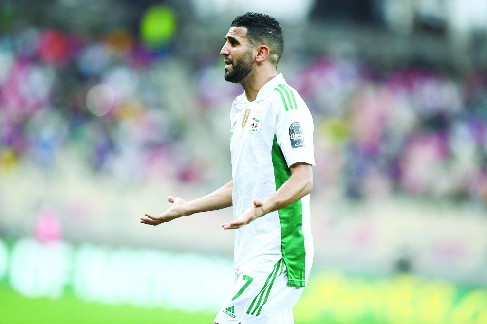 Algeria's forward Riyad Mahrez reacts during the Group E Africa Cup of Nations (CAN) 2021 at Stade de Japoma in Douala. -- AFP