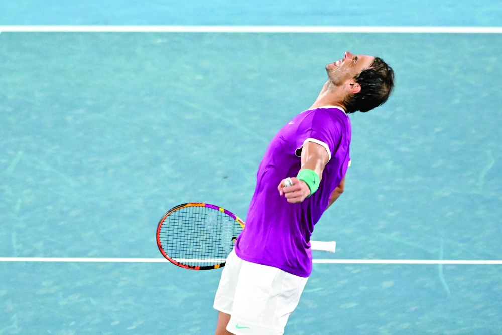 Spain's Rafael Nadal celebrates winning his third round match against Russia's Karen Khachanov. -- Reuters