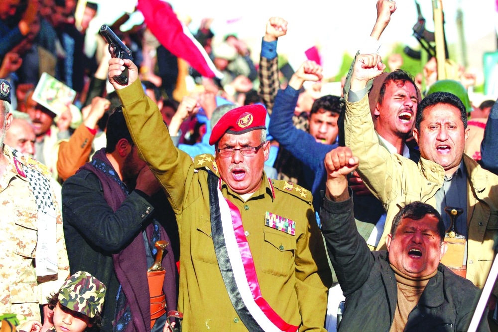 Supporters of Ansar Allah demonstrate in Sanaa to denounce a reported air strike by the coalition on a prison in the country's north. - AFP