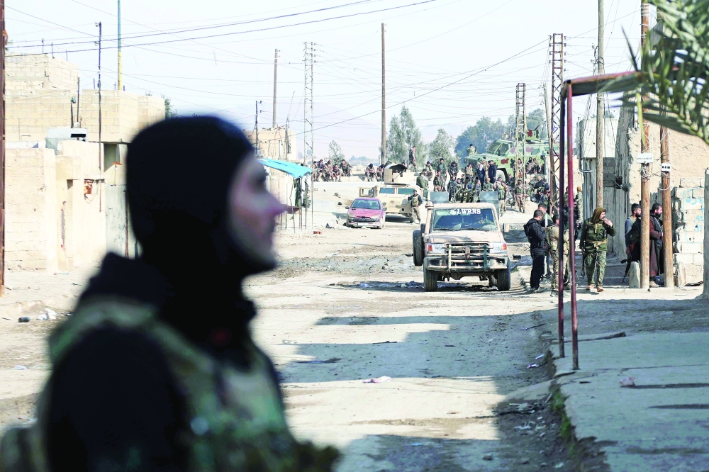 Kurdish security forces deploy in Syria's northern city of Hasakeh amid ongoing fighting for a third day with the IS group. - AFP
