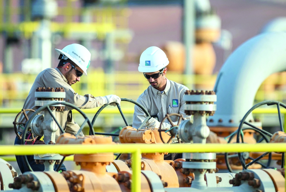 Engineers work at a Saudi Aramco facility in Saudi Arabia, in this file photo. — AFP