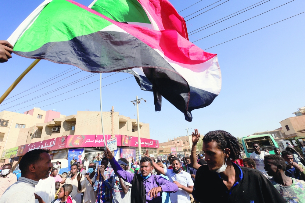 Protesters march during a rally against military rule following last month's coup in Khartoum. - Reuters