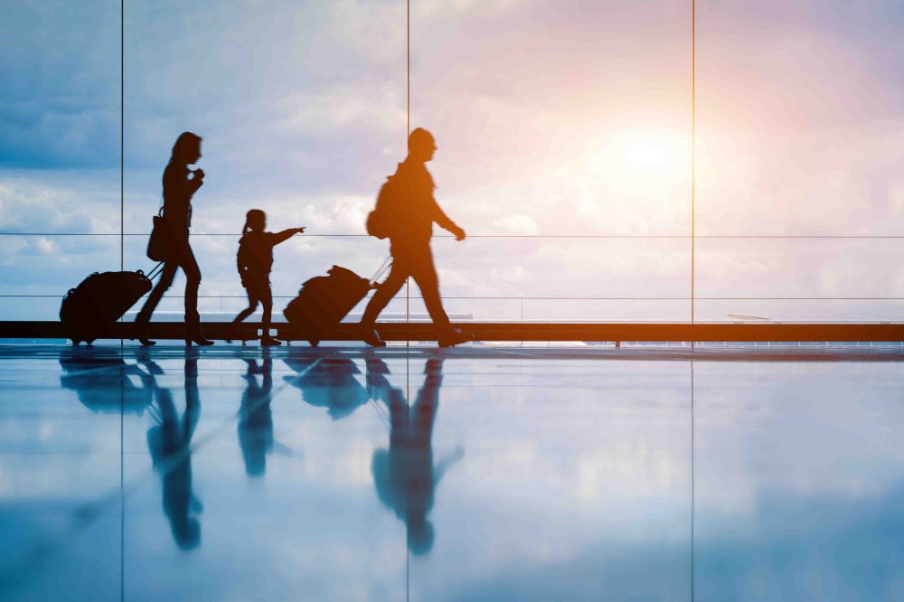 Family,At,Airport,Travelling,With,Young,Child,And,Luggage,Walking