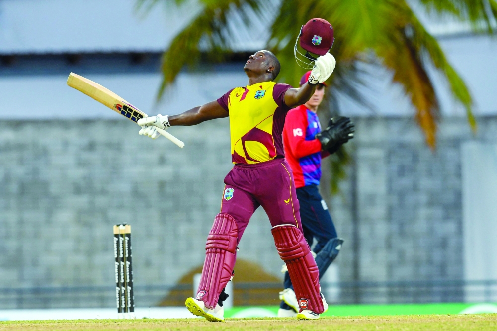 Rovman Powell of West Indies celebrates his century during the 3rd T20I between West Indies and England at Kensington Oval, Bridgetown, Barbados, on January 26, 2022. (Photo by Randy Brooks / AFP)


