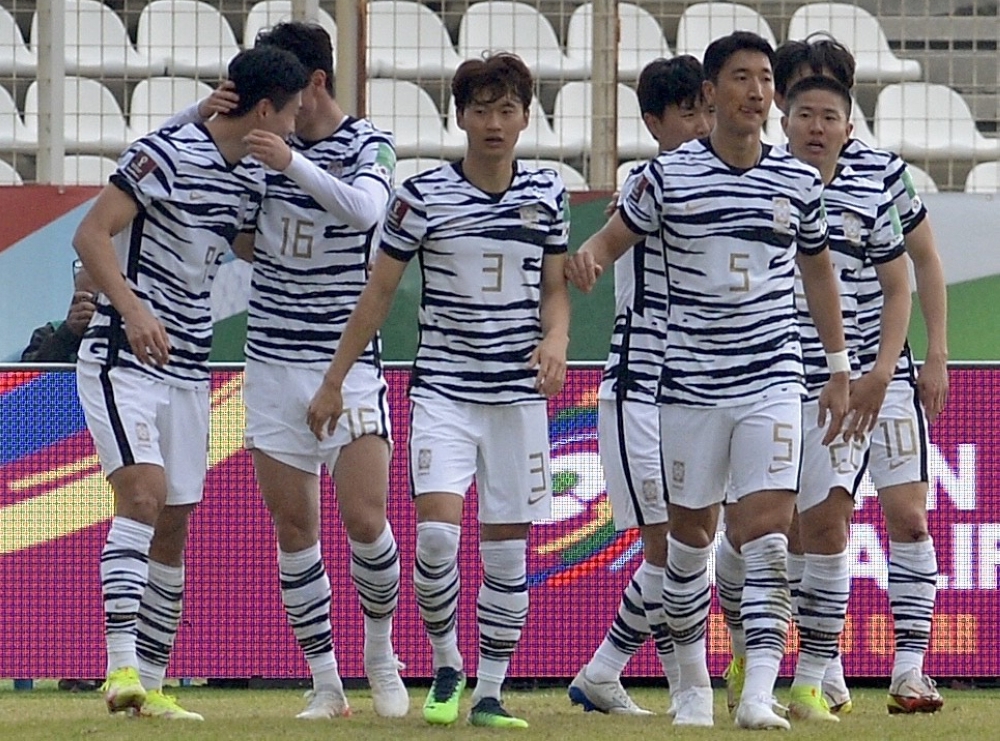 South Korea's players celebrate their goal against Lebanon during the 2022 Qatar World Cup Asian Qualifier at the Saida Stadium in the southern Lebanese city of Sidon. -- AFP