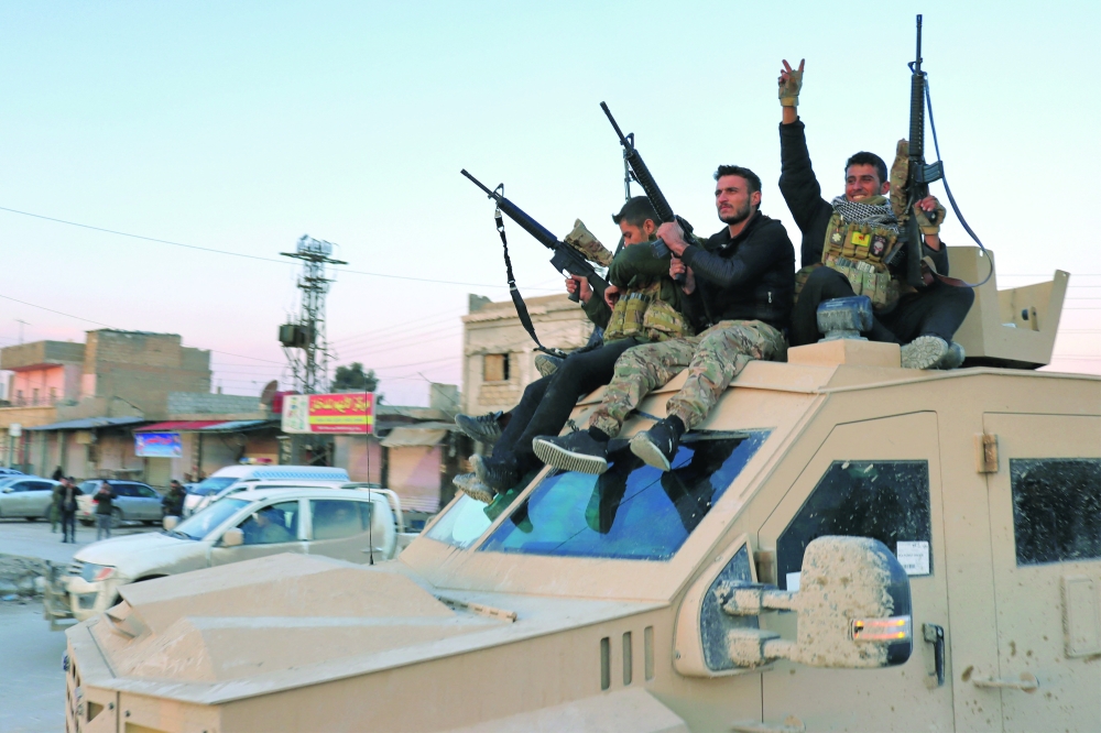Members of the Syrian Democratic Forces (SDF) deploy outside Ghwayran prison in Syria's northeastern city of Hasakeh on Wednesday, after having declared over the facility following its takeover by IS group forces. - AFP