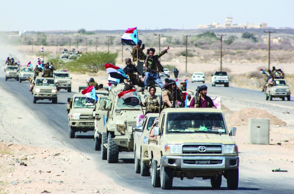Yemeni pro-government fighters from the Giants Brigade, gather on the outskirts of Ataq city, east of the Red Sea port of Aden, on their way to the frontline facing  Ansar Allah fighters, on Friday. - AFP