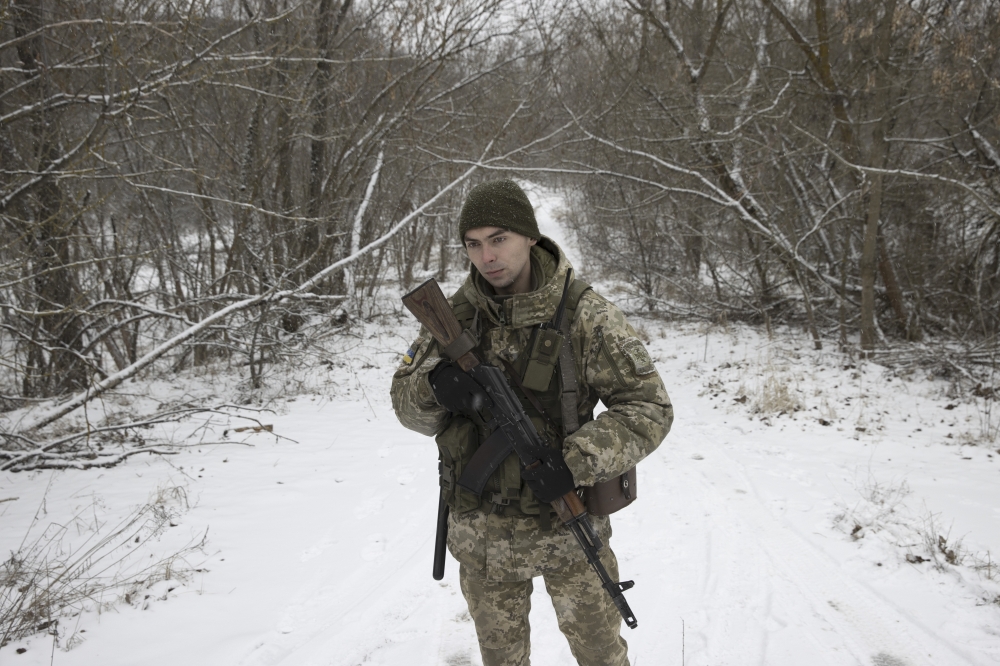 A Ukrainian border guard on patrol inside the Chernobyl Exclusion Zone, near the Ukraine-Belarus border, Jan. 9, 2022. (Brendan Hoffman/The New York Times)