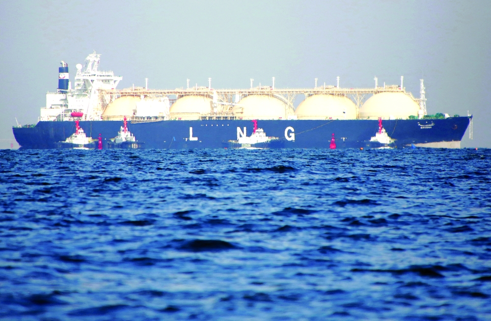 A liquefied natural gas (LNG) tanker is tugged towards a thermal power station in Futtsu, east of Tokyo, Japan. — Reuters