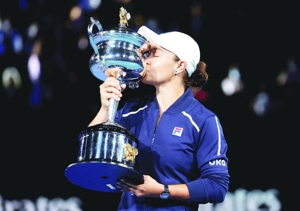 Australia's Ashleigh Barty poses as she celebrates winning the final against Danielle Collins of the U.S. with the trophy. -- Reuters