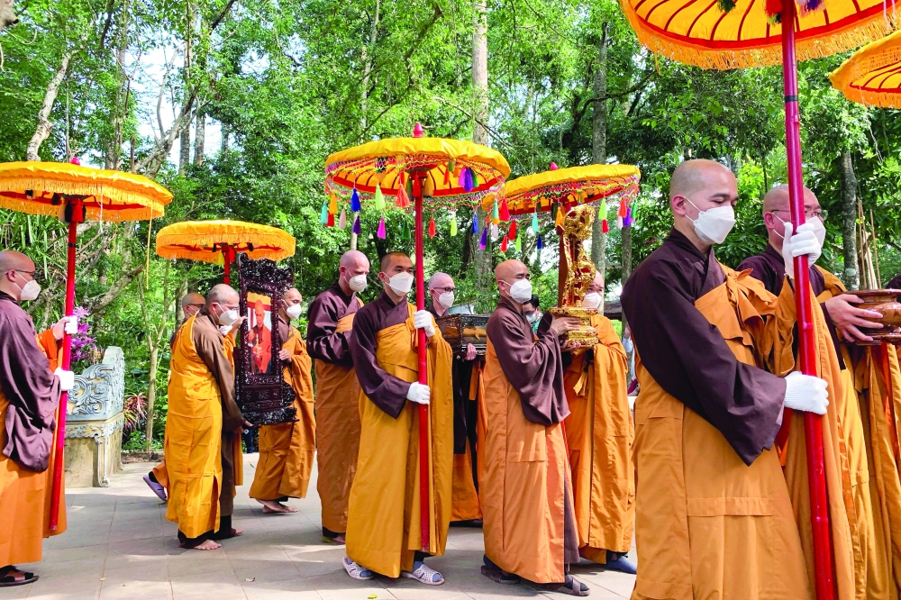Buddhist monks take part in the funeral of Thich Nhat Hanh, the Zen Buddhist monk, poet and peace activist after he died aged 95, at Tu Hieu Temple in Hue, Vietnam. - Reuters