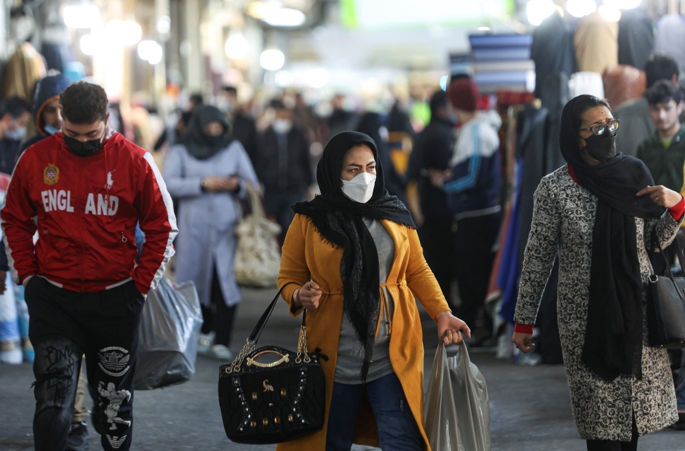  Iranians walk through Tehran Bazaar