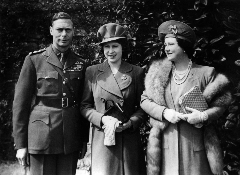 In this file photo taken on April 21, 1944 Britain's King George VI, and his wife Elizabeth Bowes-Lyon, the Queen Mother (R)and, pose with their daughter Princess Elizabeth, as they celebrate her 18th birthday at Windsor Castle. 