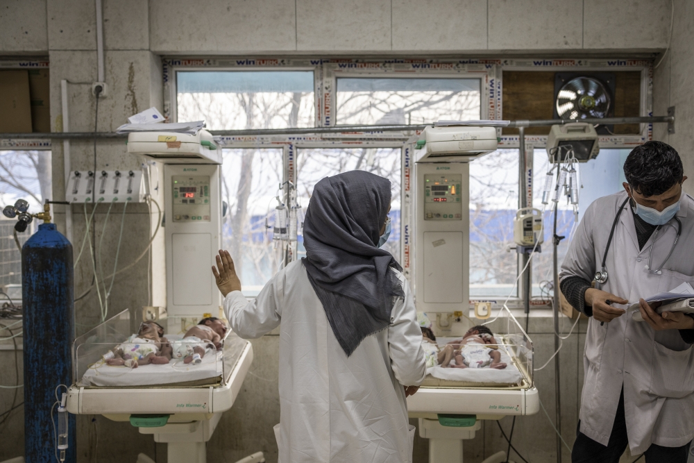 Infants double-occupy beds at an intensive care ward for babies at the Indira Gandhi Children's Hospital in Kabul, Afghanistan, Jan. 12, 2022.  (Jim Huylebroek/The New York Times)