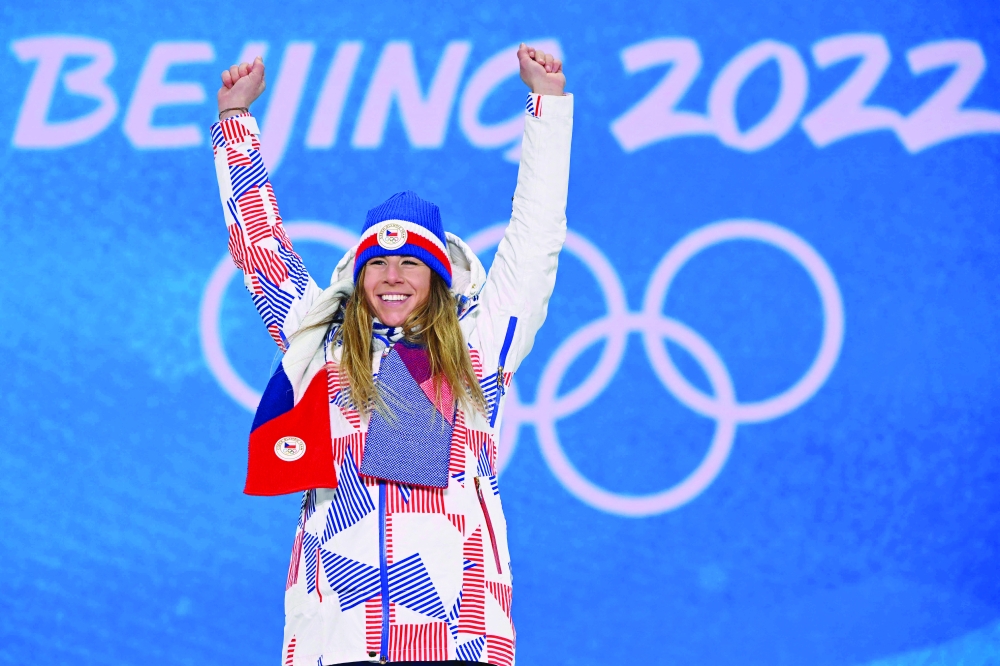 Gold medallist Czech Republic's Ester Ledecka celebrates on the podium during the victory ceremony of the snowboard women's parallel giant slalom during the Beijing 2022 Winter Olympic Games. -- AFP