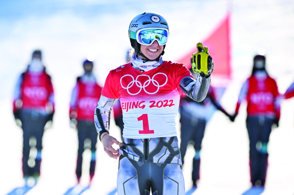 Gold medallist Czech Republic's Ester Ledecka celebrates after the snowboard women's parallel giant slalom final. -- AFP