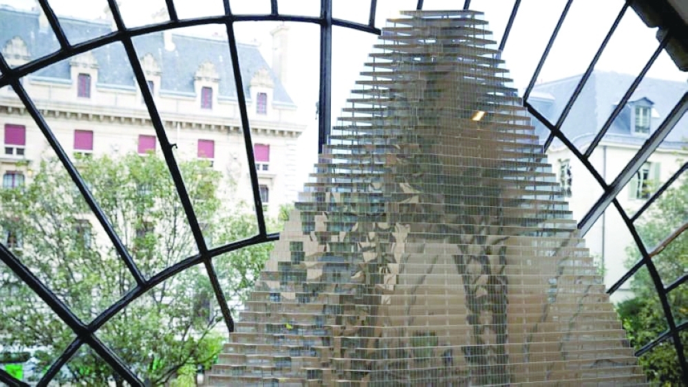 This file photo taken on November 3, 2014 shows a conceptual model of the future Tour Triangle, a proposed skyscraper, at the Pavillon de l'Arsenal in Paris. - AFP