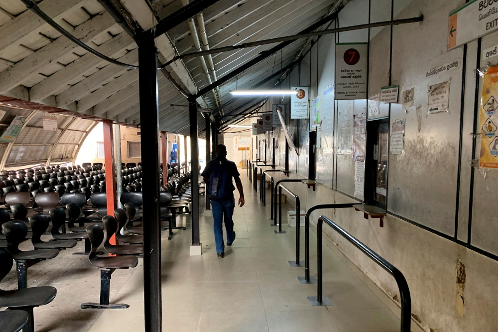 A man leaves a hospital as health workers hold a work strike in Colombo on February 11, 2022. 