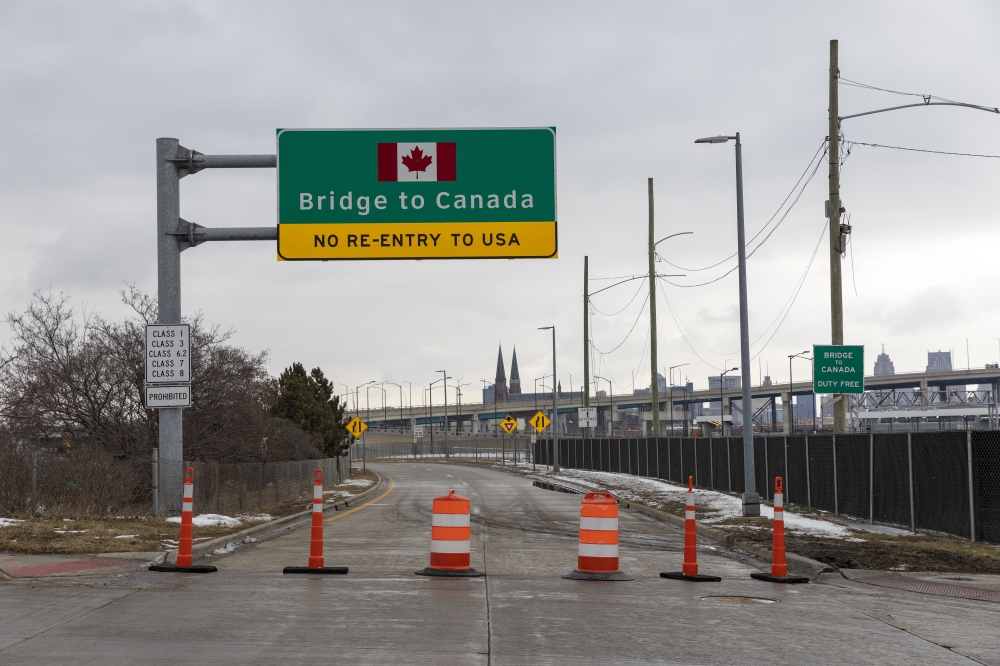 A roadway to the Ambassador Bridge in Detroit on Feb. 10, 2022, is closed for traffic going to Windsor, Ontario, Canada. Some of the world’s biggest car companies are closing production lines because of closures at the U.S.-Canada border, a spillover from demonstrations in Ottawa against vaccine mandates. (Elaine Cromie/The New York Times)