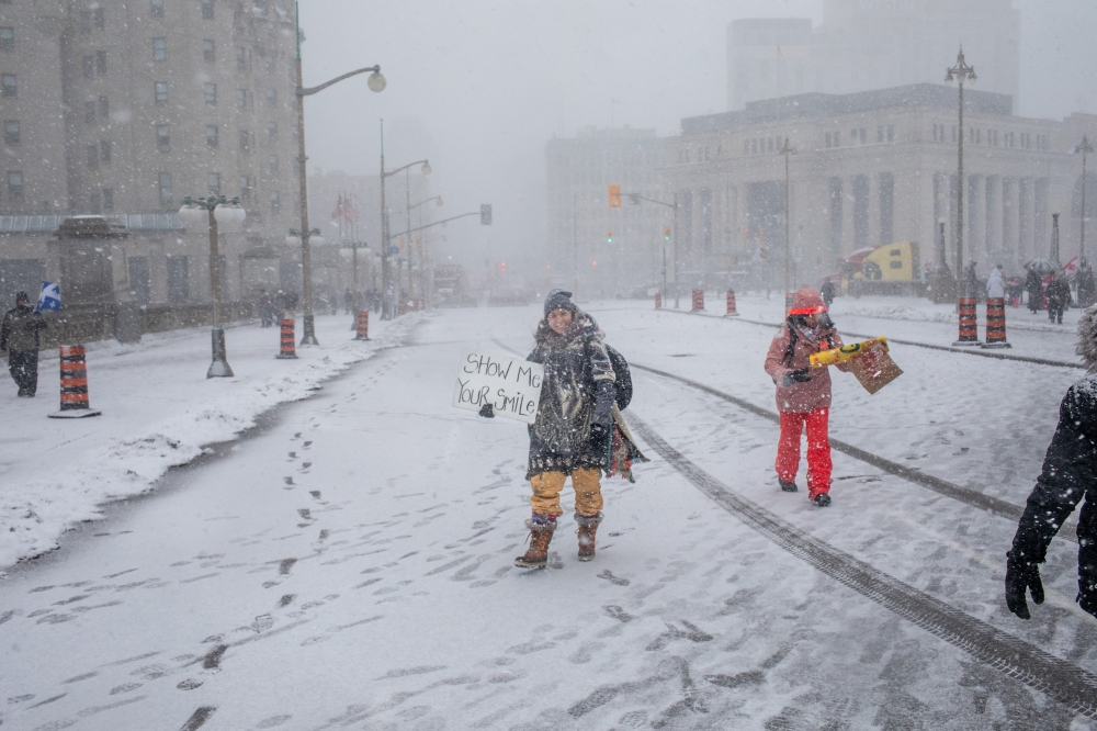 Anti-vaccine mandate protesters in downtown Ottawa, where they have blocked streets around Canadas Parliament building for weeks, Feb. 12, 2022. (Brett Gundlock/The New York Times). 