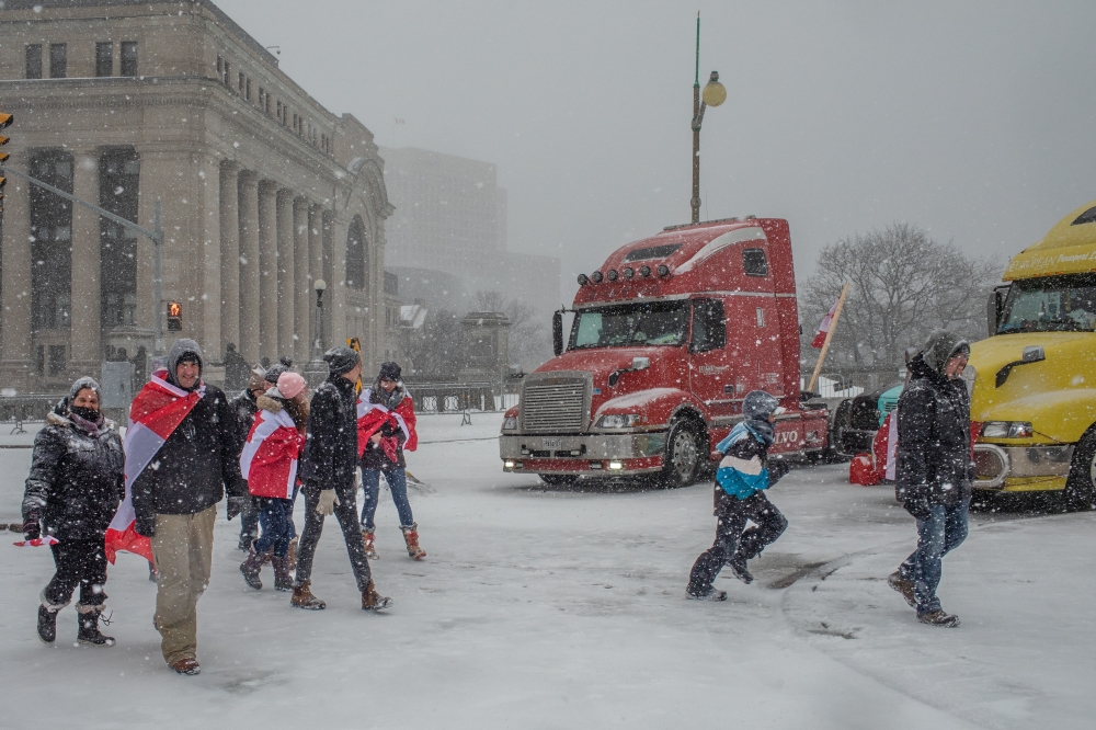 Anti-vaccine mandate protesters in downtown Ottawa, where they have blocked streets around Canadas Parliament building for weeks, Feb. 12, 2022. (Brett Gundlock/The New York Times). 