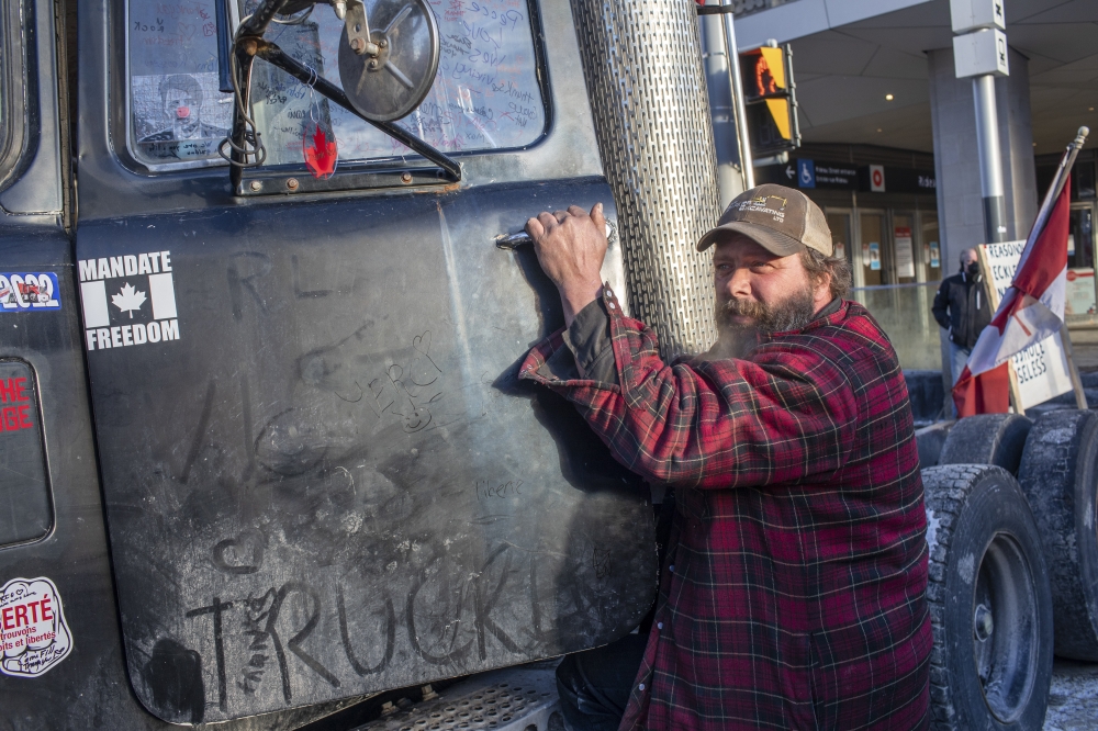 Guy Meister, a protester from Nova Scotia who has spent nearly three weeks in his truck, in Ottawa, Ontario, Feb. 13, 2022. (Brett Gundlock/The New York Times)