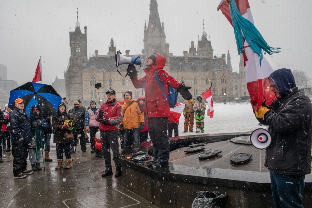 Protesters in downtown Ottawa, Ontario, on Saturday, Feb. 12, 2022, in Canada, where they are demanding an end to vaccine mandates and coronavirus restrictions. (Brett Gundlock/The New York Times)