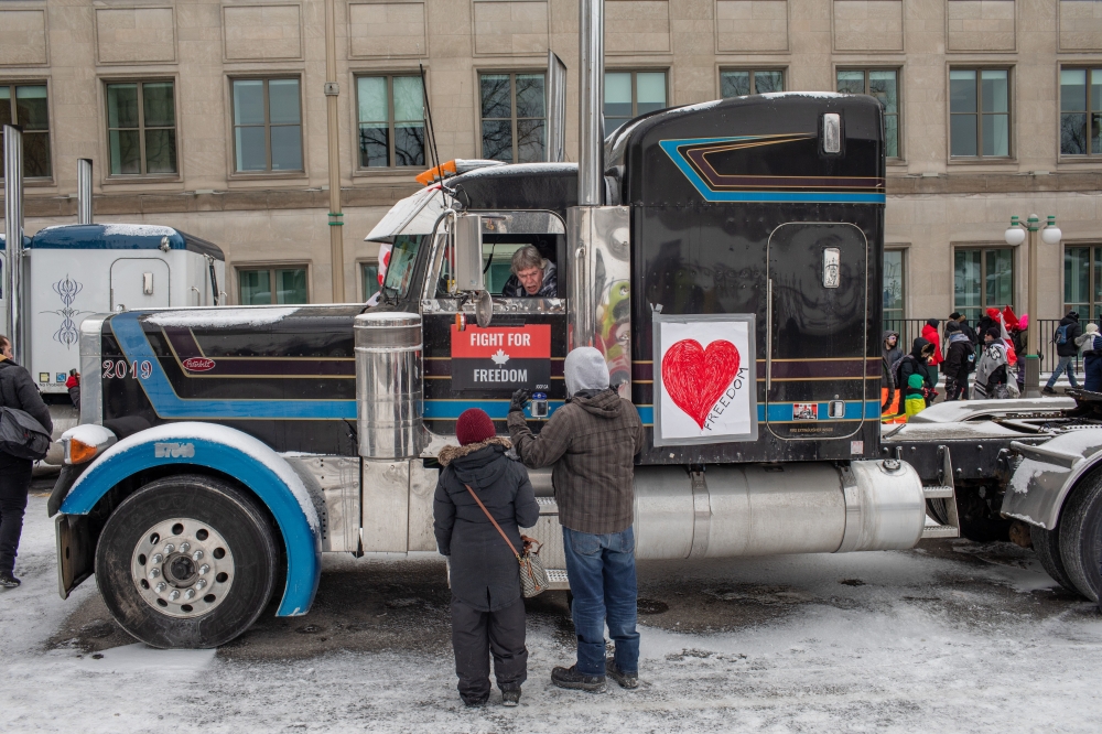 Protesters in downtown Ottawa, Ontario, on Saturday, Feb. 12, 2022, in Canada, where they are demanding an end to vaccine mandates and coronavirus restrictions. (Brett Gundlock/The New York Times)