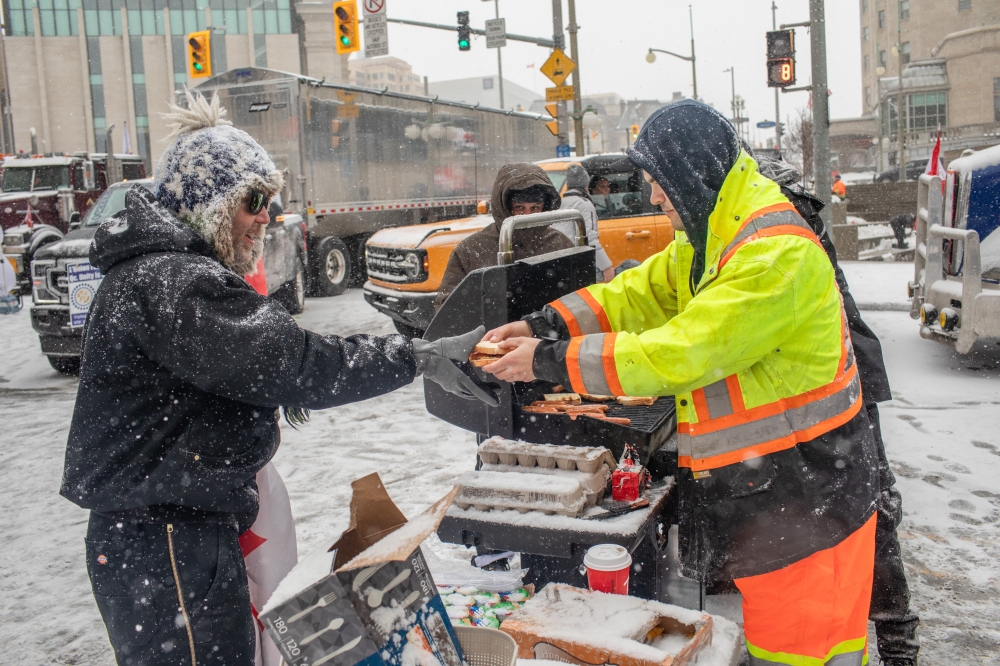Anti-vaccine mandate protesters in downtown Ottawa, where they have blocked streets around Canadas Parliament building for weeks, Feb. 12, 2022. (Brett Gundlock/The New York Times). 