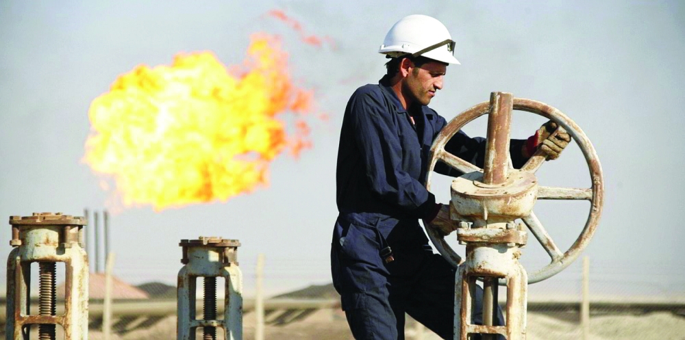 A man works at West Qurna 1 oil field in southern Iraq. — Reuters