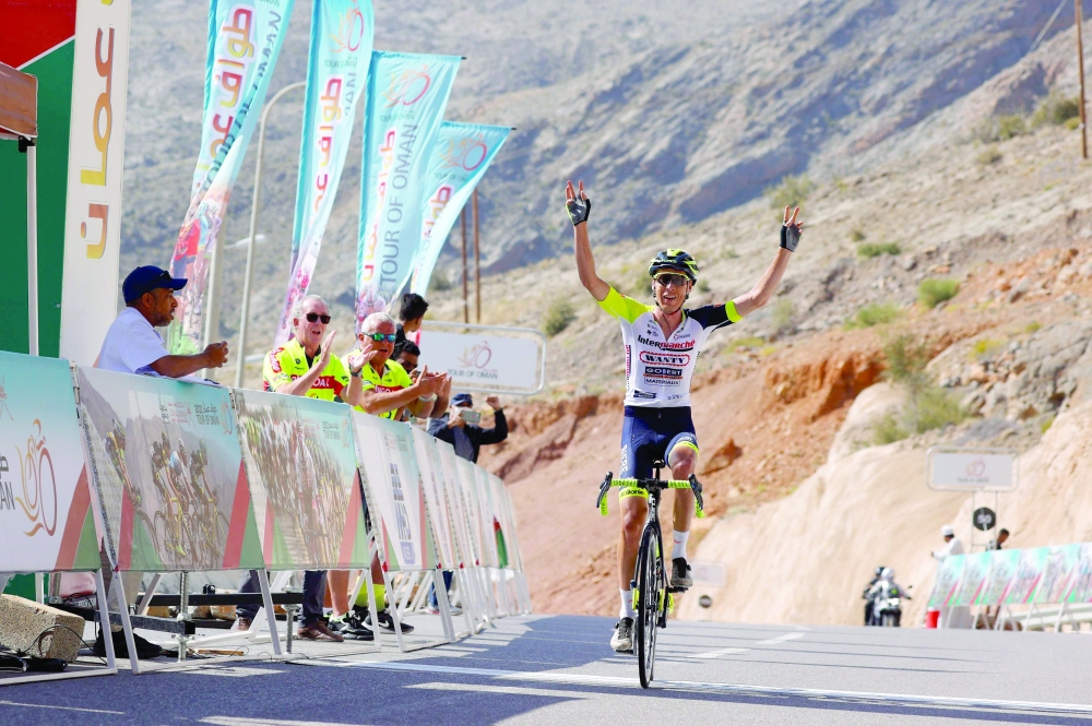 Jan Hirt of Intermarche-Wanty-Gobert reacts after winning the fifth stage of the Oman tour between Samail and Janal al-Akhdar (green mountain), in al-Dakhiliya governorate on February 14, 2022.  (Photo by Thomas SAMSON / AFP)

