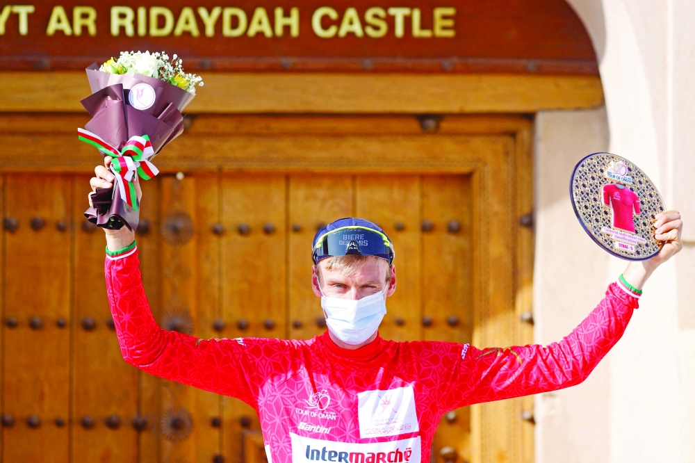 Jan Hirt of Intermarche-Wanty-Gobert poses on the podium after winning the fifth stage of the Oman tour between Samail and Janal al-Akhdar (green mountain), in al-Dakhiliya governorate on February 14, 2022.  (Photo by Thomas SAMSON / AFP)

