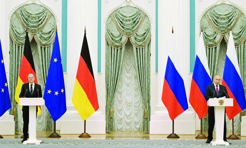 Russian President Vladimir Putin and German Chancellor Olaf Scholz at a press conference following their meeting over Ukraine security in Moscow. - AFP