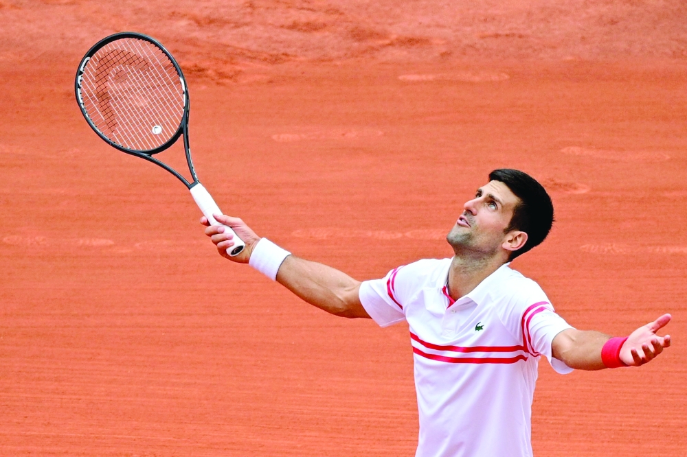 Novak Djokovic reacting after winning a point against Italy's Lorenzo Musetti during his men's singles fourth round at French Open 2021 in Paris. -- AFP File Photo
