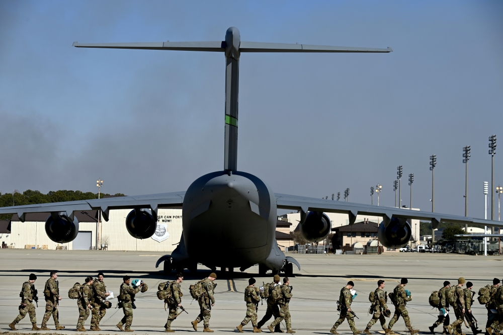 Troops at Fort Bragg in North Carolina prepare to deploy to Eastern Europe on Monday, Feb. 14, 2022. (Kenny Holston/The New York Times)