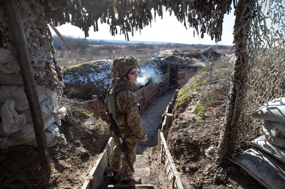 A member of the Ukrainian army at the front line near Syze, Ukraine, Feb. 15, 2022. (Tyler Hicks/The New York Times)