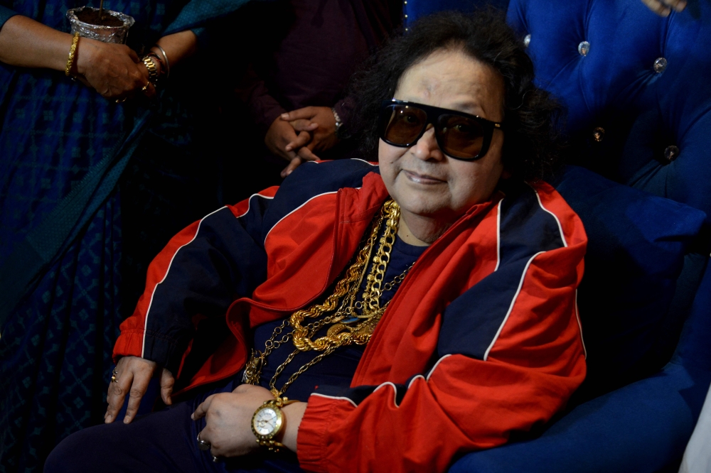 Bollywood singer, music composer Bappi Lahiri interacts with the media before planting a tree during an environment awareness campaign in Mumbai.